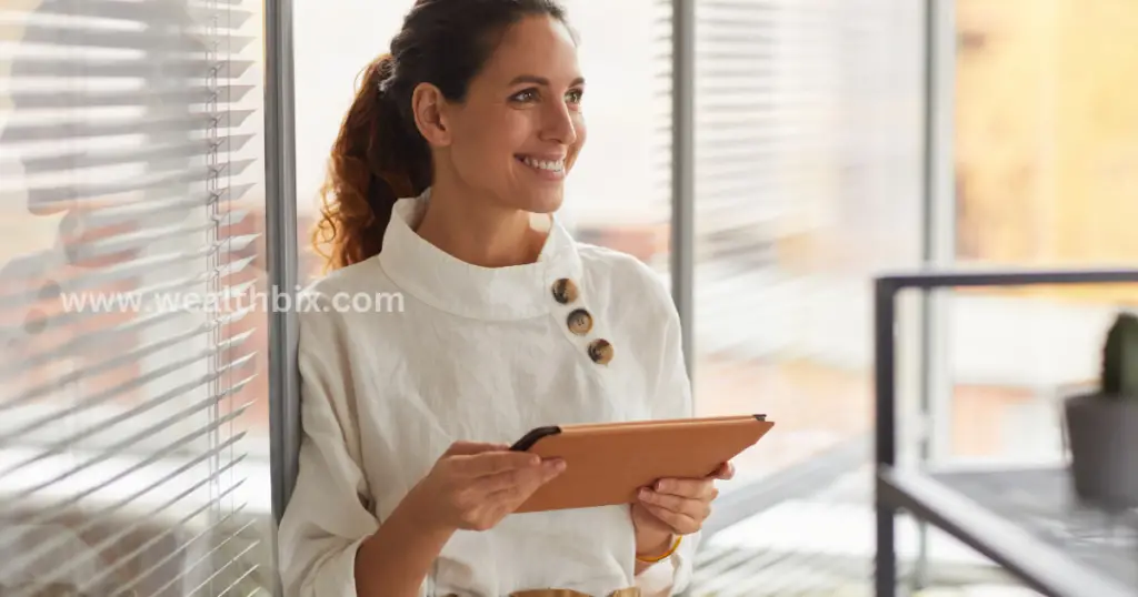 A confident entrepreneur standing with crossed arms in front of a whiteboard filled with business strategies, symbolizing success and clarity in entrepreneurship.